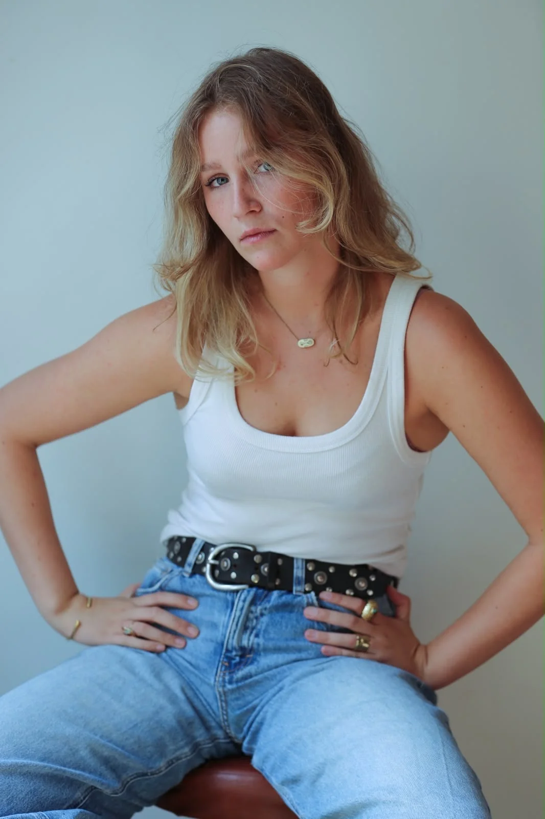 Charlotte Damman in a white tank and denim